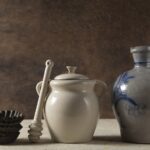 Ceramic cookware set with colorful nonstick pots and pans on kitchen counter