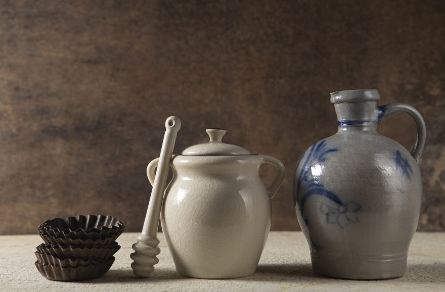 Ceramic cookware set with colorful nonstick pots and pans on kitchen counter