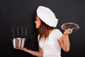 Induction cookware set with magnetic compatible pots and pans on induction cooktop