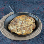 Eggs cooking in a nonstick ceramic frying pan