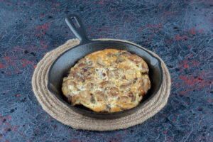 Eggs cooking in a nonstick ceramic frying pan